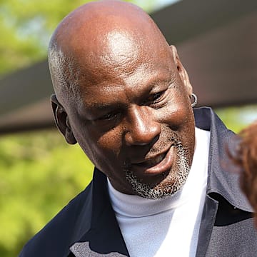 Michael Jordan takes the time to pose for a few photos and greet spectators and friends outside of The Michael Jordan Family Medical Clinic led by Novant Health. A ribbon cutting ceremony for the new clinic opening off of Greenfield Street Tuesday May 7, 2024 in Wilmington, N.C. KEN BLEVINS/STARNEWS