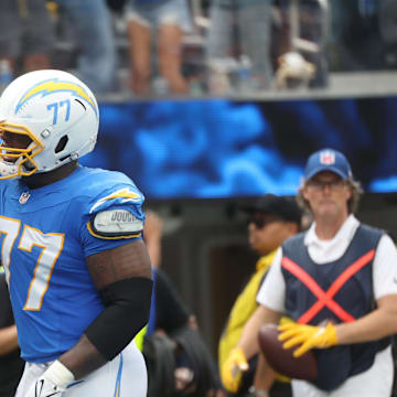 Sep 21, 2025; Inglewood, California, USA; Los Angeles Chargers wide receiver Quentin Johnston (1) and Los Angeles Chargers guard Zion Johnson (77) react after a play during the first half against the Denver Broncos at SoFi Stadium. Mandatory Credit: William Navarro-Imagn Images