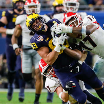 Michigan tight end Erick All (83) makes a catch against Georgia linebacker Nakobe Dean (17) during the second half of the Orange Bowl at Hard Rock Stadium in Miami Gardens, Florida, on Friday, Dec. 31, 2021.