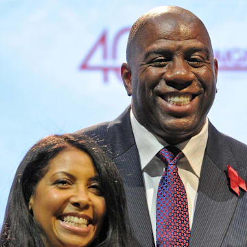 Nov. 7 , 2011; Los Angeles, CA, USA;  Magic Johnson (right) and his wife Cookie Johnson (left) during the press conference held by the Magic Johnson foundation at the Staples Center. 20 years to the date Irvin "Magic" Johnson  announced his HIV status and retirement from the NBA. Mandatory Credit: Jayne Kamin-Oncea-Imagn Images