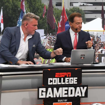 Pat McAfee Nick Saban, and Lee Corso fist bump before live broadcast during ESPN Gameday near Williams-Brice Stadium in Columbia, S.C.Saturday, September 14, 2024.