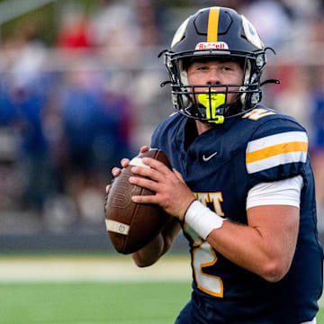 DeWitt's Traverse Moore looks to throw against Mason during the second quarter on Friday, Sept. 5, 2025, at DeWitt High School.
