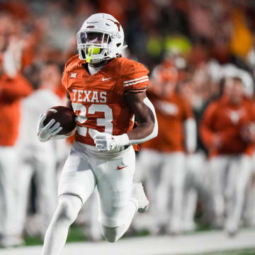 Texas running back Jaydon Blue runs the ball in to score a touchdown in the second quarter of the Longhorns' game against the Texas Tech Red Raiders, Friday, Nov. 24, 2023 at Darrell K Royal-Texas Memorial Stadium in Austin.