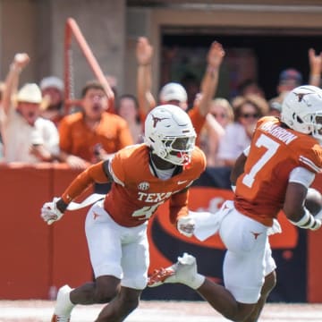 Texas Longhorns defensive back Jahdae Barron (7) runs with the ball after catching an interception as the Texas Longhorns take on Colorado State at Darrell K Royal-Texas Memorial Stadium in Austin Saturday, Aug. 31, 2024.