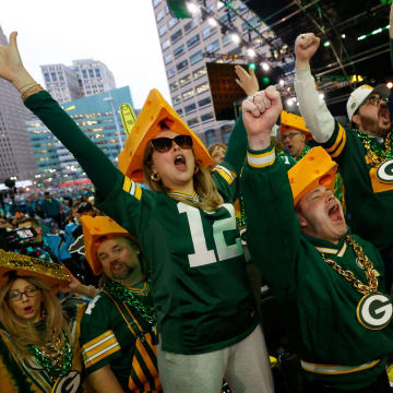 Green Bay Packers fans yell as their pick is made in the second round of 2024 NFL draft in Detroit on Friday, April 26, 2024.