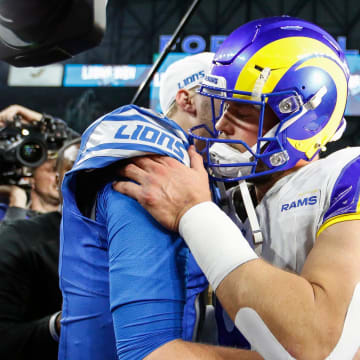 Detroit Lions quarterback Jared Goff hugs Los Angeles Rams quarterback Matthew Stafford after the Lions' 24-23 win in the NFC wild-card game at Ford Field in Detroit on Sunday, Jan, 14, 2024.