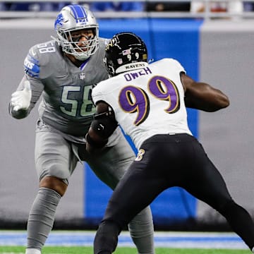 Detroit Lions offensive tackle Penei Sewell blocks Baltimore Ravens linebacker Odafe Oweh during the first half at Ford Field in Detroit on Sunday, Sept. 26, 2021.
