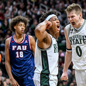 Michigan State's Jeremy Fears Jr., left, celebrates with Jaxon Kohler, right, after Fears' score and a Florida Atlantic foul during the first half on Saturday, Dec. 21, 2024, in East Lansing.