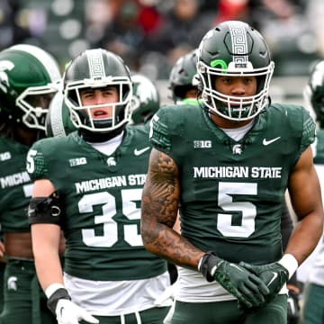 Michigan State's Jordan Hall and the linebackers prepare for a drill during the Spring Showcase on