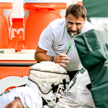 Michigan State's defensive coordinator Joe Rossi looks on while working with the linebackers during the first day of football camp on Tuesday, July 30, 2024, in East Lansing.