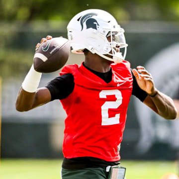 Michigan State's quarterback Aidan Chiles throws a pass during the first day of football camp on Tuesday, July 30, 2024, in East Lansing.
