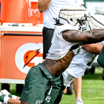 Michigan State's Jordan Turner participates in a drill during the first day of football camp on Tuesday, July 30, 2024, in East Lansing.