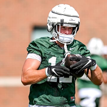 Michigan State's Jack Velling runs after a catch during the first day of football camp on Tuesday, July 30, 2024, in East Lansing.