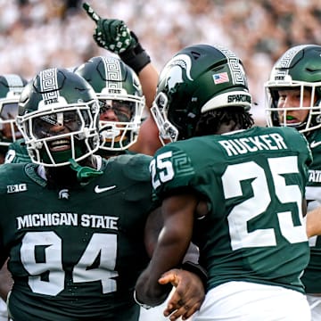 Michigan State's D'Quan Douse, left, celebrates his safety with teammates during the first quarter in the game against Florida Atlantic on Friday, Aug. 30, 2024, at Spartan Stadium in East Lansing.