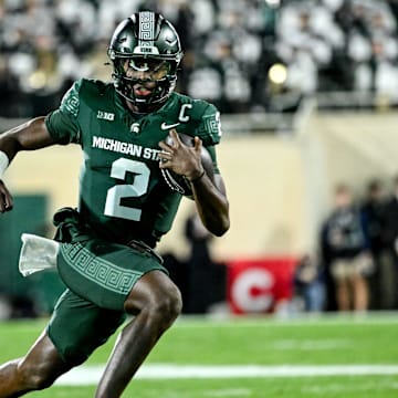 Michigan State's Aidan Chiles runs for a gain against Iowa in the second quarter on Saturday, Oct. 19, 2024, at Spartan Stadium in East Lansing.