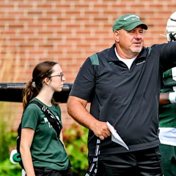 Michigan State's offensive line coach Jim Michalczik works with the team during the first day of football camp on Tuesday, July 30, 2024, in East Lansing.