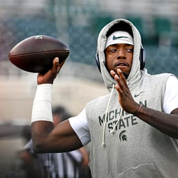 Michigan State's Aidan Chiles warms up before the football game against Western Michigan on Friday, Aug. 29, 2025, in East Lansing.