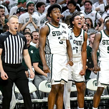 From left, Michigan State's Cam Ward, Jordan Scott, Trey Fort and Divine Ugochukwu celebrate after Coen Carr's dunk against Colgate during the second half on Monday, Nov. 3, 2025, at the Breslin Center in East Lansing.