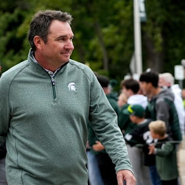 Michigan State's head coach Jonathan Smith walks past fans before the football game against Boston College on Saturday, Sept. 6, 2025, at Spartan Stadium in East Lansing.