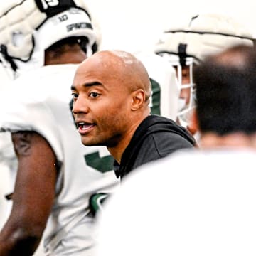 Michigan State safeties coach James Adams works with players during football practice on Tuesday, April 8, 2025, in East Lansing.