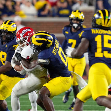 Michigan edge rusher Josaiah Stewart (0) tackles Fresno State running back Malik Sherrod (2) during the second half at Michigan Stadium in Ann Arbor on Saturday, Aug. 31, 2024.