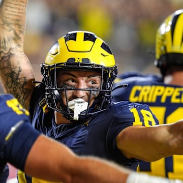 Michigan tight end Colston Loveland (18) celebrates his touchdown against Fresno State during the second half at Michigan Stadium in Ann Arbor on Saturday, Aug. 31, 2024.