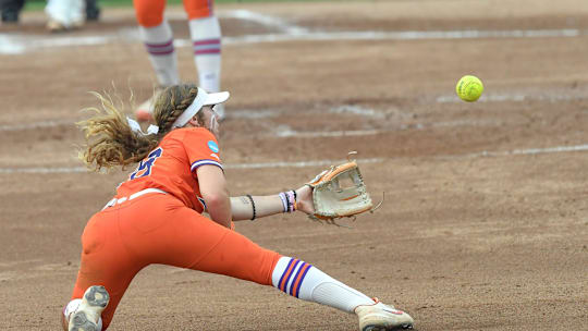 Clemson senior Maddie Moore (28) dishes a ball she dove for toward Clemson freshman Marian Collins (5) to force out USC Upstate junior Aimie Johnson (30) during the top of the fifth inning of the NCAA Softball Tournament Clemson Regional at McWhorter Stadium in Clemson Friday, May 16, 2025.