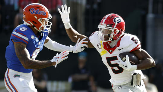 Oct 28, 2023; Jacksonville, Florida, USA; Georgia Bulldogs wide receiver Rara Thomas (5) runs against Florida Gators cornerback Jalen Kimber (8) in the first half at EverBank Stadium. Mandatory Credit: Jeff Swinger-USA TODAY Sports