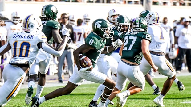 Michigan State's Charles Brantley returns an interception for a touchdown during the second quarter in the game against Prair