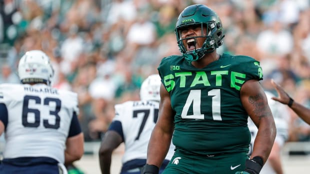 Michigan State defensive tackle Derrick Harmon (41) celebrates after sacking Akron quarterback Jeff Undercuffler Jr.