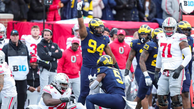 Michigan defensive lineman Kris Jenkins (94) celebrates a tackle against Ohio State during the Wolverines 30-24 win in Ann Ar