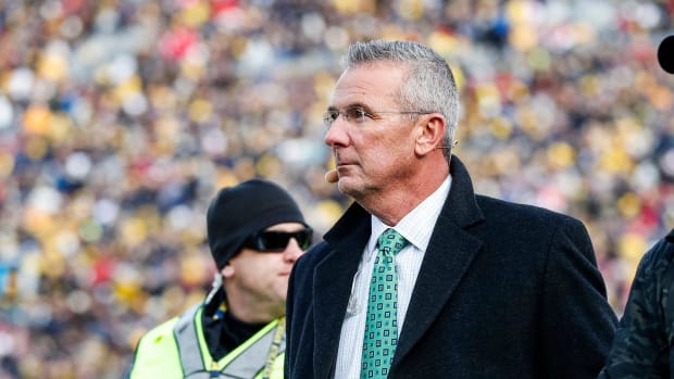 Nov 25, 2023; Ann Arbor, MI, USA;  Ohio State Buckeyes former head coach Urban Meyer walks by the end zone during the first h