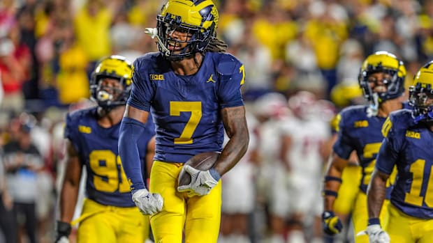 Michigan defensive back Makari Paige (7) runs through the end zone after he thought he made an interception.