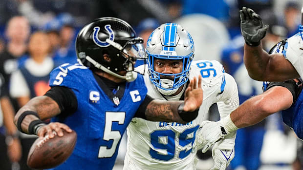 Detroit Lions defensive end Za'Darius Smith (99) pressures Indianapolis Colts quarterback Anthony Richardson (5)