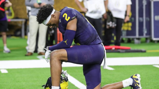 Michigan defensive back Will Johnson prays before kickoff against Washington in the national championship game at NRG Stadium in Houston on Monday, Jan. 8, 2024.