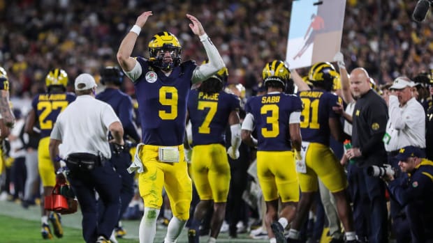 Michigan quarterback J.J. McCarthy celebrates a play against Alabama during overtime of the Rose