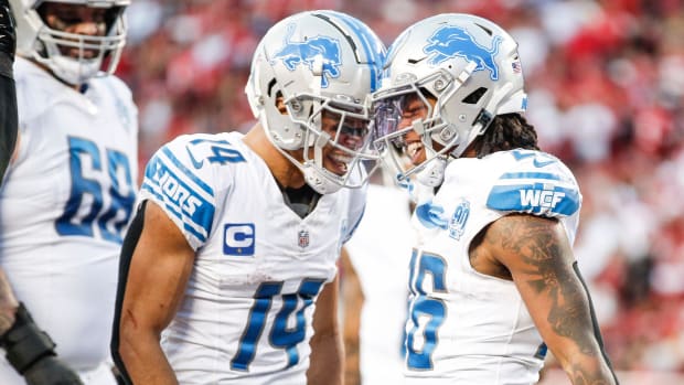 Lions running back Jahmyr Gibbs celebrates touchdown with wide receiver Amon-Ra St. Brown during NFC championship game.