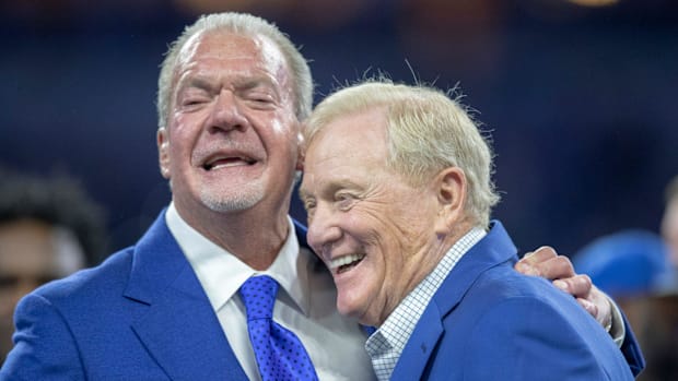 Jim Irsay (left), embraces Bill Polian, during a Ring of Honor celebration for Dwight Freeney in November 2019.