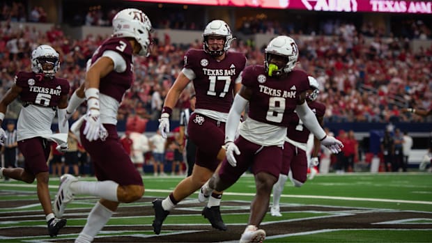 Texas A&M Aggies tight end Theo Melin Ohrstrom (17), running back Le'Veon Moss (8) and receiver Noah Thomas (3) celebrate.