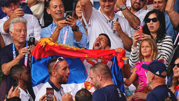 Novak Djokovic waving the Serbian flag at Roland Garros.