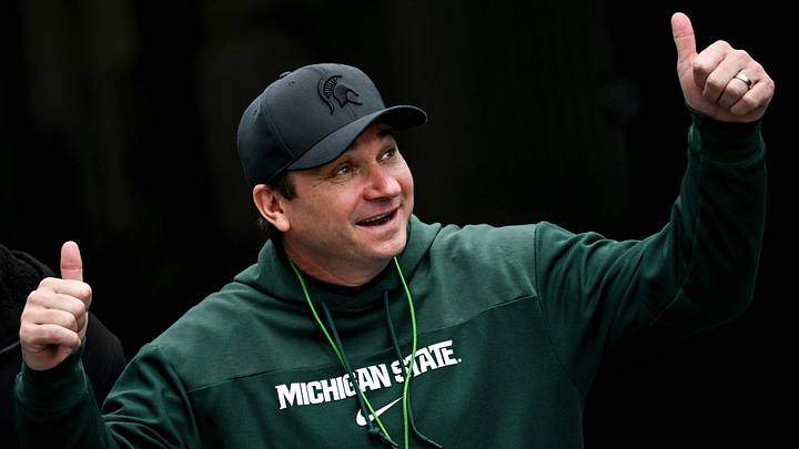 Michigan State's head coach Jonathan Smith gives a thumbs up to the crowd as he enters the field during the football Spring Showcase on Saturday, April 20, 2024, at Spartan Stadium in East Lansing.