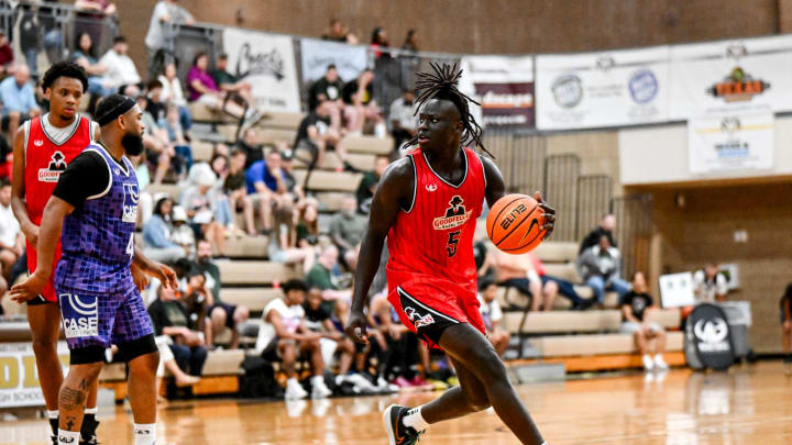 Michigan State freshman and Team Goodfellas' Kur Teng, moves the ball against Team Case Credit Union in the game on Tuesday, June 25, 2024, during the Moneyball Pro-Am at Holt High School.