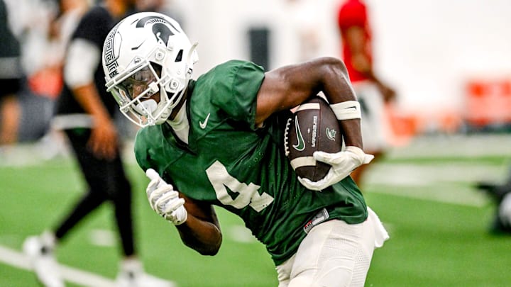 Michigan State's Jaron Glover runs after a catch during camp on Monday, Aug. 5, 2024, at the indoor practice facility in East Lansing.