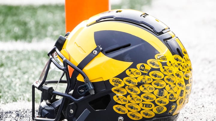 Michigan running back Blake Corum's helmet sits on the turf during warmups before the Ohio State game at Michigan Stadium in Ann Arbor on Saturday, Nov. 25, 2023.