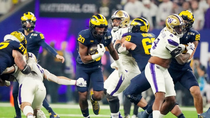 Michigan running back Kalel Mullings runs the ball during the first quarter of the College Football Playoff national championship game against Washington at NRG Stadium in Houston, Texas on Monday, Jan. 8, 2024.