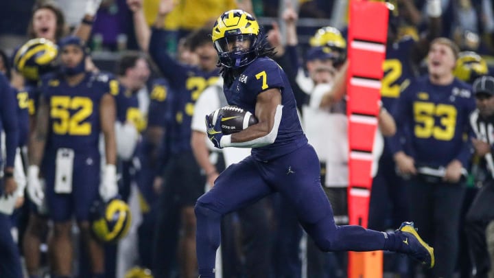 Michigan running back Donovan Edwards runs for a touchdown against Washington during the first half of the national championship game at NRG Stadium in Houston, Texas on Monday, Jan. 8, 2024.