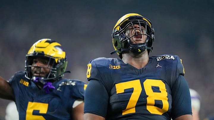 Michigan defensive lineman Kenneth Grant celebrates a sack on Washington quarterback Michael Penix Jr. in the second quarter during the College Football Playoff national championship game against Washington at NRG Stadium in Houston, Texas on Monday, Jan. 8, 2024.