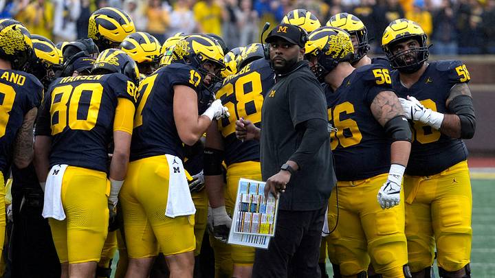 Michigan football coach Sherrone Moore looks at the ref during a time out during first-half action between Michigan and Minnesota at Michigan Stadium in Ann Arbor on Saturday, Sept. 28, 2024.