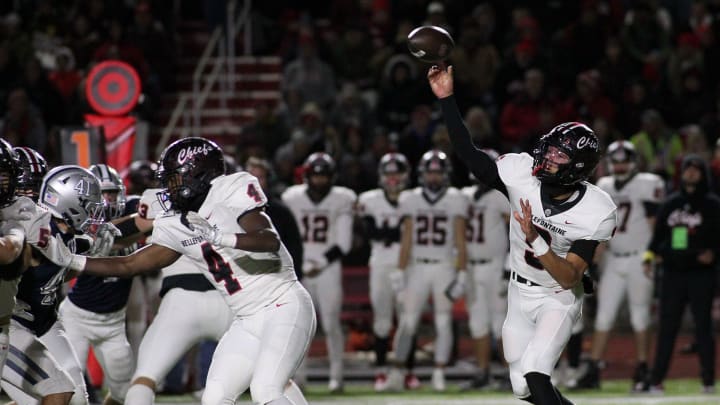 Bellefontaine's Tavien St. Clair throws to the outside against Granville in the Division III, Region 11 semifinal on Friday, November 11, 2023, at London High School.