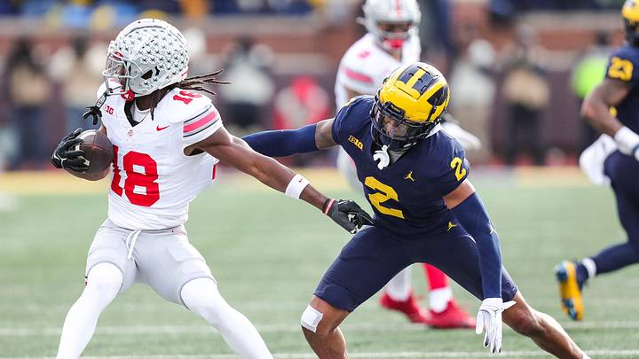 Michigan defensive back Will Johnson defends Ohio State receiver Marvin Harrison Jr. during the second half at Michigan Stadium in Ann Arbor on Saturday, Nov. 25, 2023.